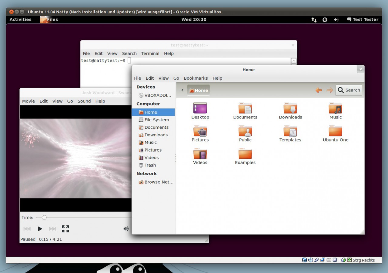 GNOME 3 in einer VirtualBox mit geöffnetem Dateimanager und einem laufenden Videoplayer auf dem Desktop