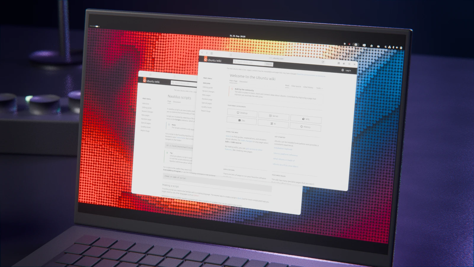 Geöffneter Laptop zeigt zwei Fenster der Ubuntu-Wiki-Webseite vor buntem Hintergrund.